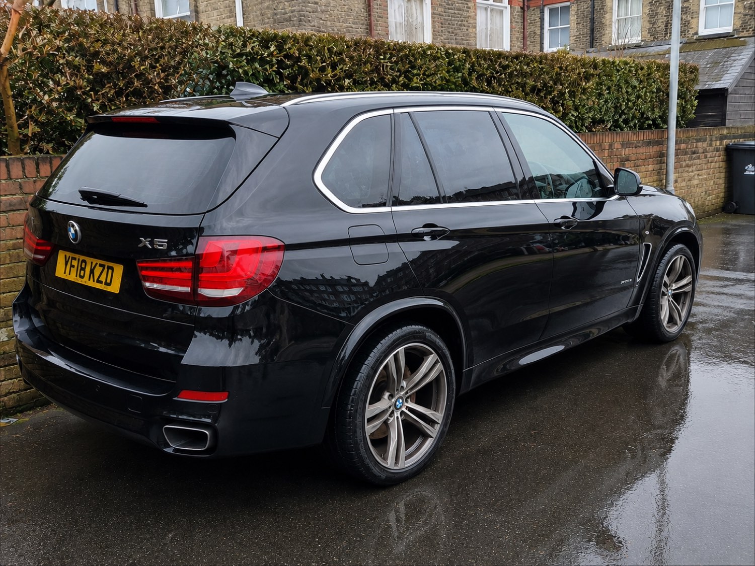 The same car after washing — clean bodywork and wheels