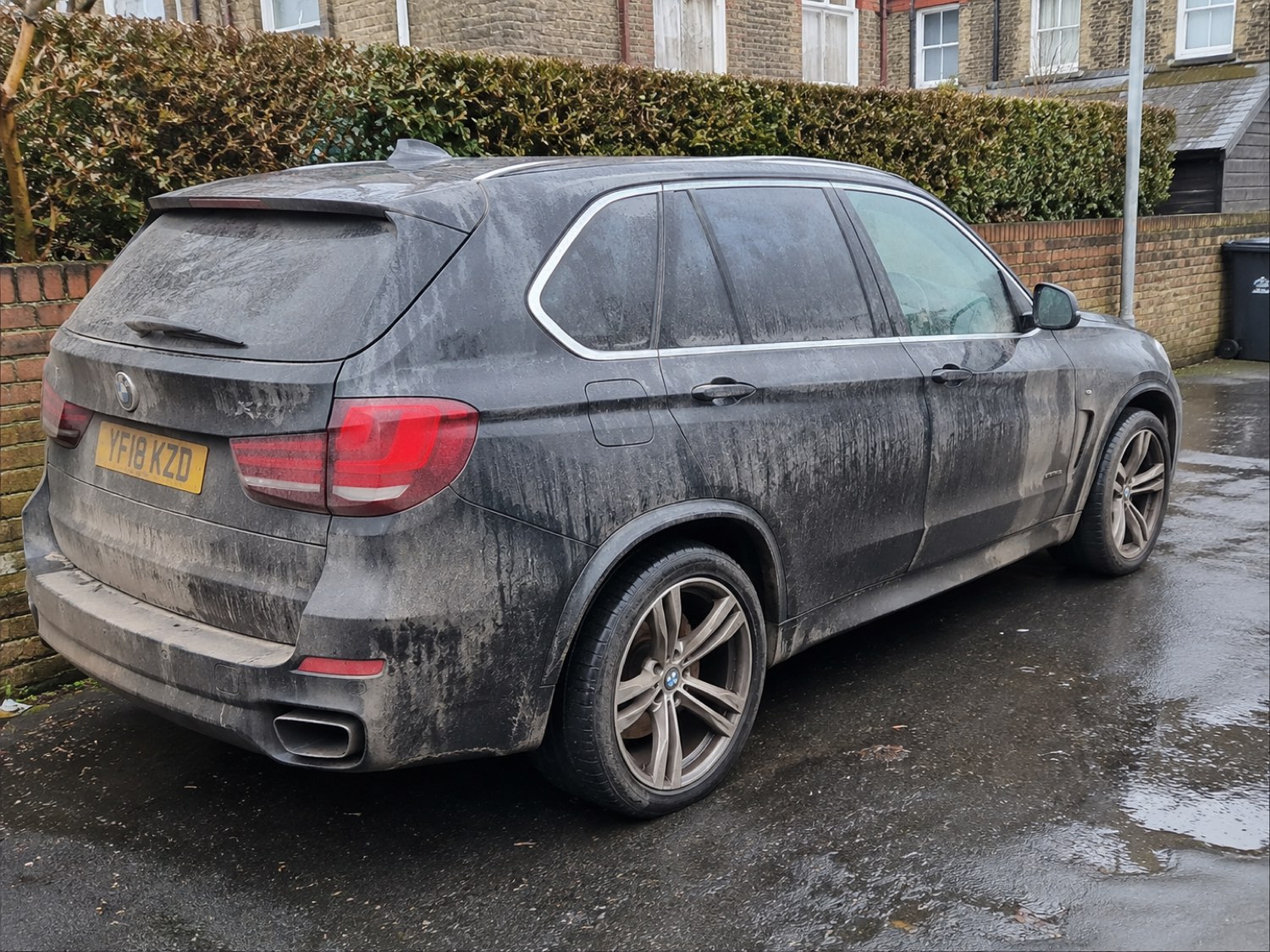 Car before washing — road grime and dirt